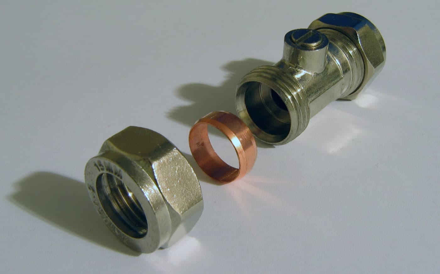 A brass compression fitting isolating valve on 15mm pipe.